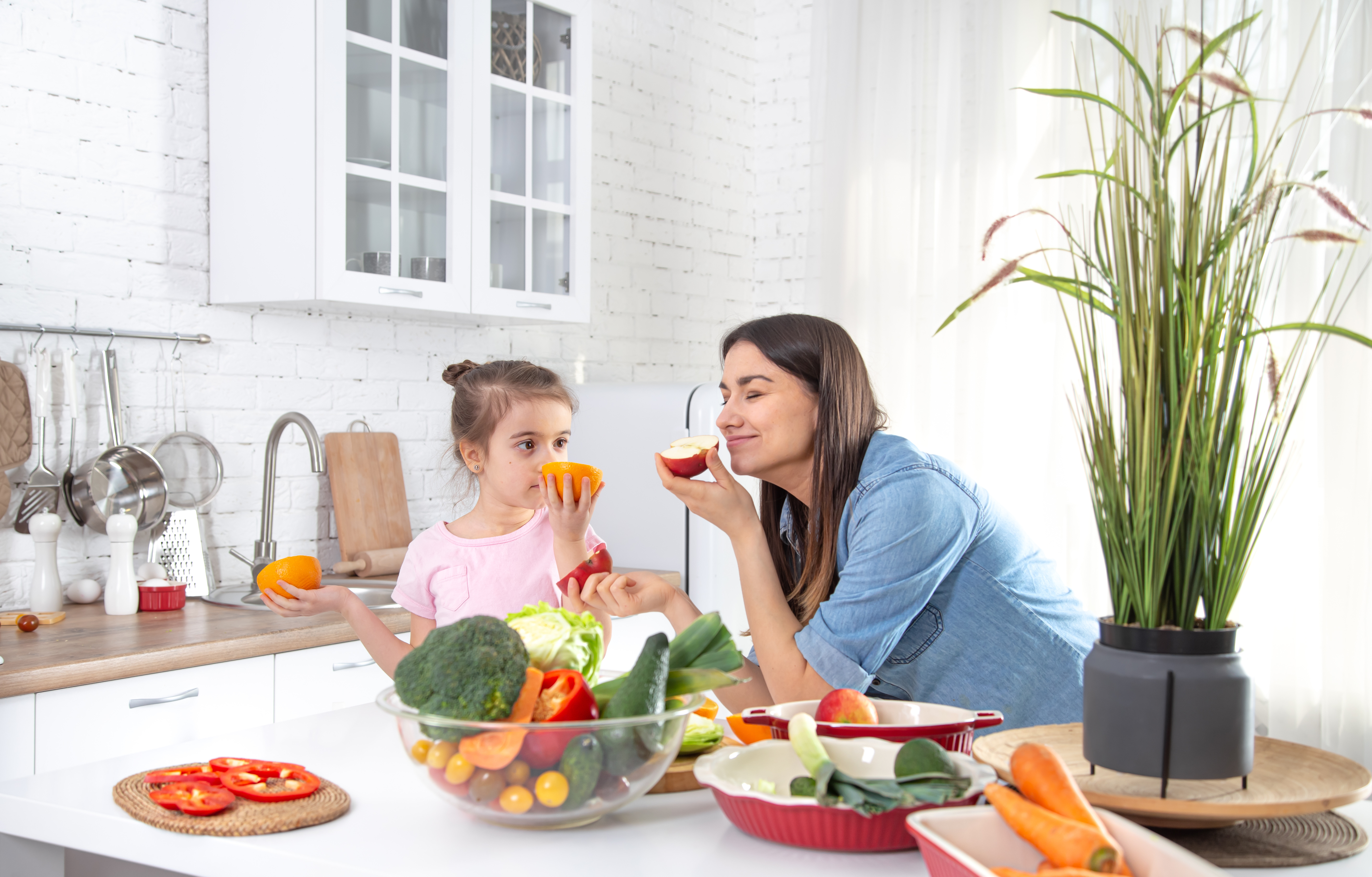 Celebrating food exploration for autistic individuals, smelling a new fruit or vegetable